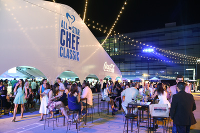 Guests enjoy the outdoor lounge at the Lexus All-Star Chef Classic event.