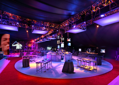A red carpet, display tables and stage lighting created a moody event space on the Event Deck.