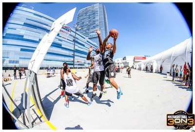 Basketball players face off on the Event Deck during the Nike 3ON3 Basketball Tournament.
