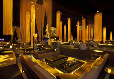 Fabric columns and a striking gold light turned the Event Deck into the Capitol from the Hunger Games for the premiere after party.