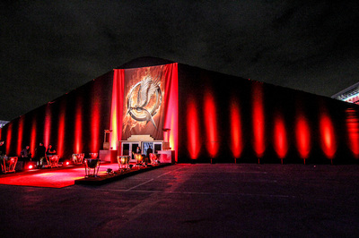 A giant mockingjay and red up lighting created a surreal entrance for the Hunger Games premiere after party on the Event Deck.