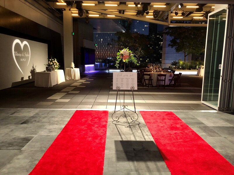 A red carpet is set out ahead of dinging tables at The Rooftop Terrace.