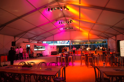 Tables and stage lighting fill the Event Deck for an event.