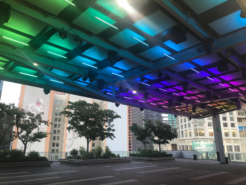 LED rainbow lights displayed on the awning of The Rooftop Terrace.